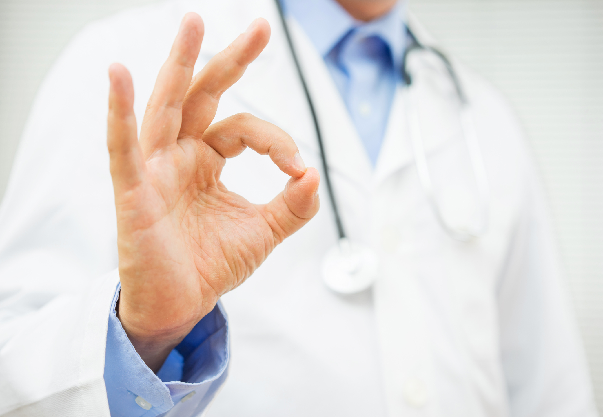 doctor showing ok sign, concept of healty man